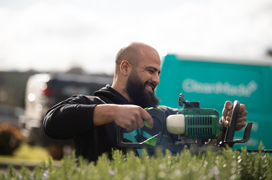 cleanmade technician cleaning and maintaining the garden